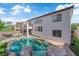 Stunning backyard oasis with a sparkling pool and spa, perfect for outdoor relaxation at 8268 Nelson Ridge Ln, Las Vegas, NV 89178