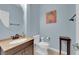 Well-lit powder room with modern fixtures, round mirror, and neutral color scheme at 8268 Nelson Ridge Ln, Las Vegas, NV 89178