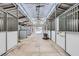 Inside a horse barn with stalls, a clear roof, and concrete floors at 8440 La Cienega St, Las Vegas, NV 89123