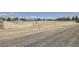 Gated horse property with white fencing and a brick column entry at 8440 La Cienega St, Las Vegas, NV 89123