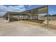 Open horse area with covered stalls, offering shade and shelter for livestock in a rural setting at 8440 La Cienega St, Las Vegas, NV 89123