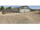 View of the horse barn with stalls and outdoor enclosures, designed for the care and housing of horses at 8440 La Cienega St, Las Vegas, NV 89123