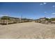 Wide shot of horse shelters and stalls, offering ample room and necessary features for animal care and comfort at 8440 La Cienega St, Las Vegas, NV 89123