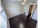 Bedroom with hardwood floors, ceiling fan, and mirrored closet at 8455 W Sahara Ave # 213, Las Vegas, NV 89117