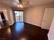 Bedroom with hardwood floors, ceiling fan, sliding glass doors to a patio at 8455 W Sahara Ave # 213, Las Vegas, NV 89117