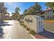 Welcoming entrance to The Enclaves, with desert landscaping and inviting architecture, located at address 8455 at 8455 W Sahara Ave # 213, Las Vegas, NV 89117