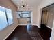 Dining room with hardwood floors, and decorative light fixture at 8455 W Sahara Ave # 213, Las Vegas, NV 89117