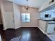 Dining area with hardwood floors, natural light, and modern light fixture at 8455 W Sahara Ave # 213, Las Vegas, NV 89117