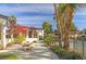 Exterior view of building, showcasing community courtyard with seating and landscaping at 8455 W Sahara Ave # 213, Las Vegas, NV 89117