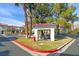 Exterior view of condos, surrounded by mature landscaping, with picnic tables at 8455 W Sahara Ave # 213, Las Vegas, NV 89117