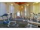 Community gym with exercise equipment and natural light from large windows at 8455 W Sahara Ave # 213, Las Vegas, NV 89117
