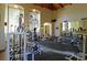 Well-equipped fitness center with exercise machines, weights, and mirrored walls at 8455 W Sahara Ave # 213, Las Vegas, NV 89117
