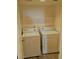Bright laundry room with washer and dryer on tile flooring at 8455 W Sahara Ave # 213, Las Vegas, NV 89117
