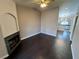 Spacious living room with a fireplace and dark wood floors with an open concept floorplan at 8455 W Sahara Ave # 213, Las Vegas, NV 89117