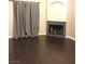 Spacious living room with hardwood floors and a fireplace at 8455 W Sahara Ave # 213, Las Vegas, NV 89117