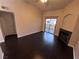 Living room featuring hardwood floors, fireplace, and sliding glass doors to a patio at 8455 W Sahara Ave # 213, Las Vegas, NV 89117