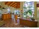 Community clubhouse lobby with tiled floors, wooden desk, and potted plants at 8455 W Sahara Ave # 213, Las Vegas, NV 89117