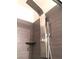 Modern shower with a rain head fixture and stone-look tile at 8455 W Sahara Ave # 213, Las Vegas, NV 89117
