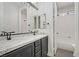 Bathroom with double sinks and dark gray cabinets at 8544 Garden Valley Ct, Las Vegas, NV 89178