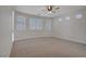 Bright, empty bedroom provides ample natural light through multiple windows at 8544 Garden Valley Ct, Las Vegas, NV 89178