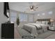 This staged bedroom features recessed lighting and large bright windows at 8544 Garden Valley Ct, Las Vegas, NV 89178
