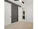 Bedroom with ceiling fan, neutral carpet, and white closets adjacent to the doorway at 8544 Garden Valley Ct, Las Vegas, NV 89178