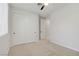 Bedroom with neutral carpet, ceiling fan, and white closet at 8544 Garden Valley Ct, Las Vegas, NV 89178