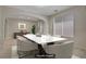 Bright dining room with modern decor, white marble table, and natural light from the large window at 8544 Garden Valley Ct, Las Vegas, NV 89178