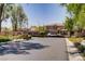 Welcoming gated entrance to this beautiful community with lush landscaping and mature trees, providing both security and curb appeal at 8544 Garden Valley Ct, Las Vegas, NV 89178