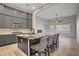 Spacious kitchen features a granite island, stainless appliances, and gray cabinetry at 8544 Garden Valley Ct, Las Vegas, NV 89178