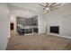 Open-concept floorplan showcases the kitchen and living room with a fireplace at 8544 Garden Valley Ct, Las Vegas, NV 89178
