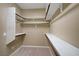 Walk-in closet with multiple shelves, poles, and carpeted floor at 8544 Garden Valley Ct, Las Vegas, NV 89178