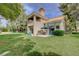 Charming backyard with cozy patio seating and lush lawn, perfect for outdoor relaxation at 8591 Heather Downs Dr, Las Vegas, NV 89113