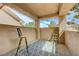Outdoor balcony with seating, offering a relaxing space and scenic views at 8591 Heather Downs Dr, Las Vegas, NV 89113