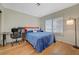 Cozy bedroom with a desk, ample natural light, and comfortable living space at 8591 Heather Downs Dr, Las Vegas, NV 89113
