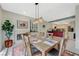 Bright dining area flows into the kitchen, featuring a fireplace and modern decor at 8591 Heather Downs Dr, Las Vegas, NV 89113