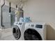 Functional laundry room with modern washer and dryer for efficient laundry care at 8591 Heather Downs Dr, Las Vegas, NV 89113