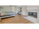 Spacious main bedroom with wood flooring, fireplace and light neutral paint at 8591 Heather Downs Dr, Las Vegas, NV 89113