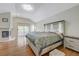 A bright main bedroom features a fireplace, a large bed, and a balcony at 8591 Heather Downs Dr, Las Vegas, NV 89113
