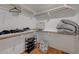 Walk-in closet with hardwood floors and white shelving at 8591 Heather Downs Dr, Las Vegas, NV 89113