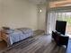Bedroom featuring a bed, tv, and a door to the outside at 8805 Jeffreys St # 1103, Las Vegas, NV 89123