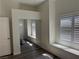 This bedroom features large windows, mirrored closet doors and vinyl floors at 8805 Jeffreys St # 1103, Las Vegas, NV 89123