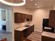 Bright kitchen featuring dark wood cabinets, stainless steel appliances, and plenty of counter space at 8805 Jeffreys St # 1103, Las Vegas, NV 89123