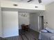 Cozy living room featuring wood-look floors, ceiling fan and dining area for flexible living at 8805 Jeffreys St # 1103, Las Vegas, NV 89123