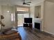 Bright living room featuring a fireplace, a sliding glass door, and modern flooring at 8805 Jeffreys St # 1103, Las Vegas, NV 89123