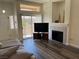 Open-plan living room with fireplace, TV, and outside views at 8805 Jeffreys St # 1103, Las Vegas, NV 89123