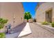 A gravel-covered backyard with a walkway leading to a gate at 8913 Loggers Mill Ave, Las Vegas, NV 89143
