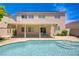 Backyard with a covered patio, in-ground pool and serene views at 8913 Loggers Mill Ave, Las Vegas, NV 89143