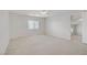 Large, airy bedroom with neutral carpet and large windows lets in plenty of natural light at 8913 Loggers Mill Ave, Las Vegas, NV 89143
