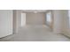 Large bedroom with neutral carpet, ceiling fan, and natural light at 8913 Loggers Mill Ave, Las Vegas, NV 89143